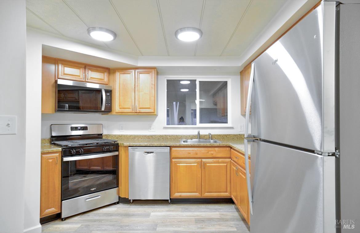 150 Silverado Trail, Unit 64 Napa, CA 94559 - Photo 4 of 21 a kitchen with a sink appliances and cabinets