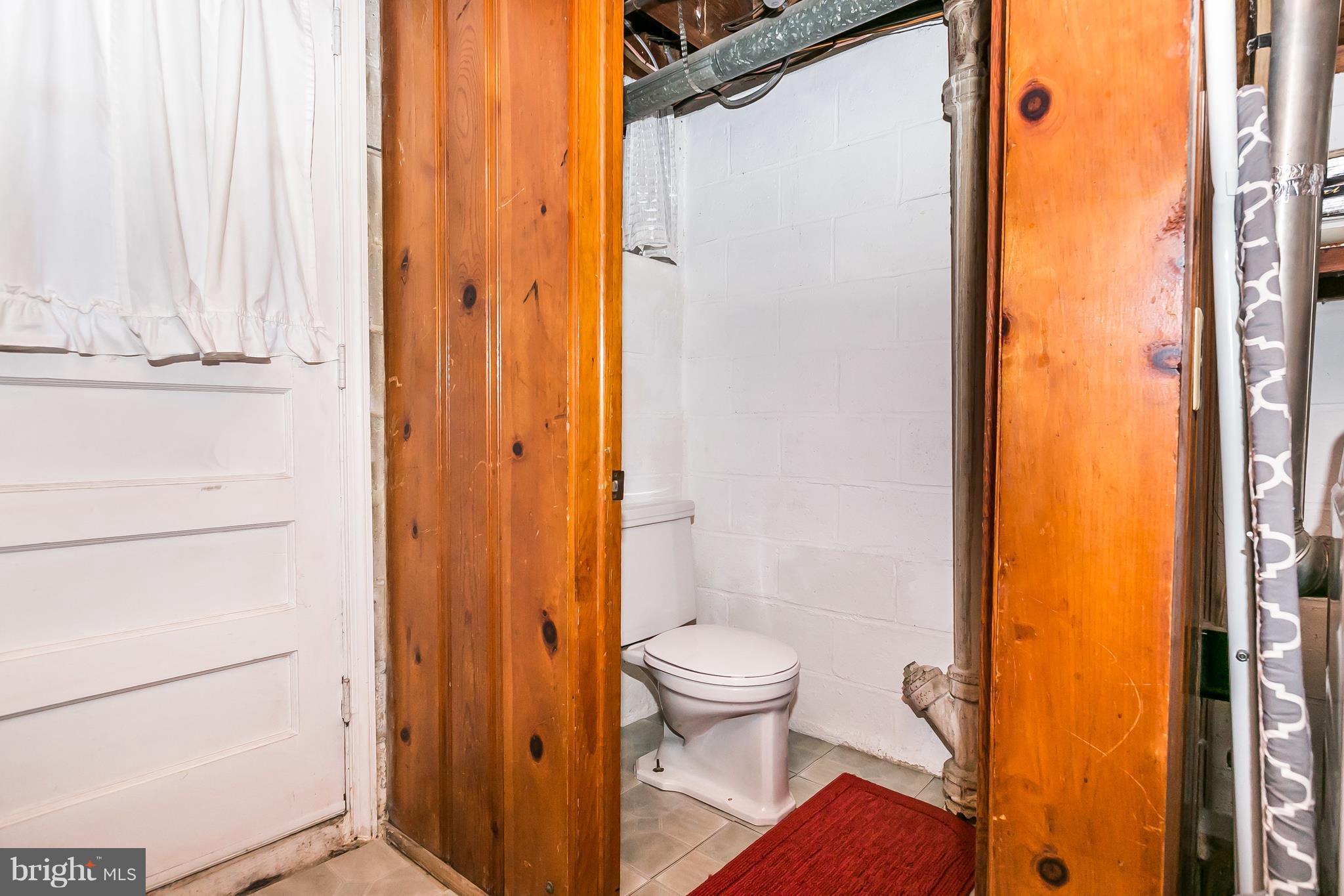 2107 Searles Road Baltimore, MD 21222 - Photo 23 of 26 Enclosed flush (large sink next to washer)
