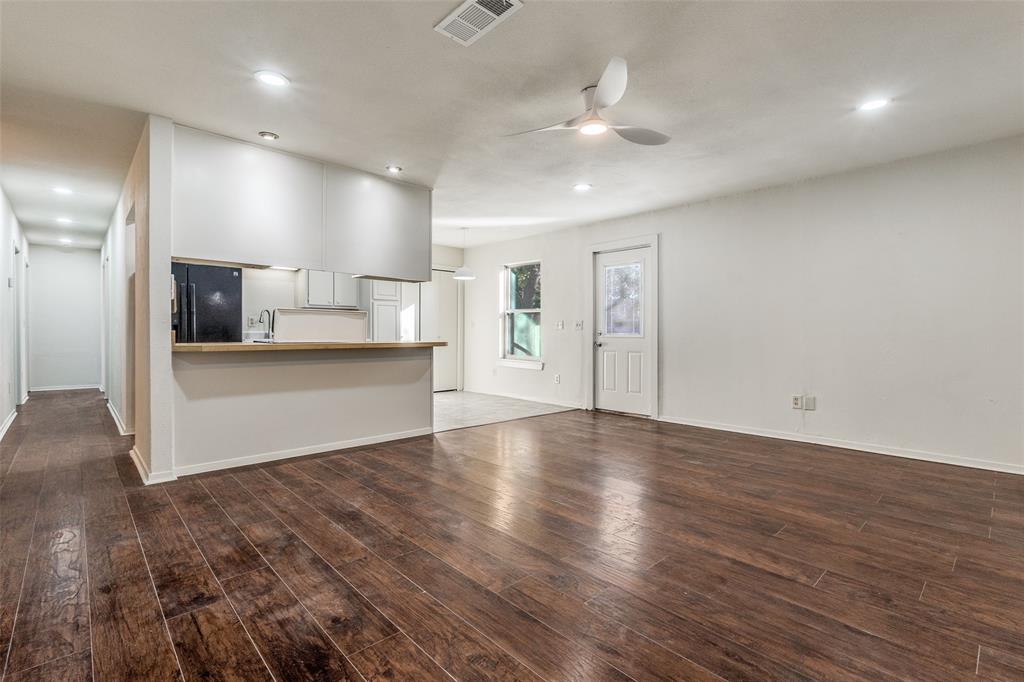 4728 Meadow Ridge Drive Dallas, TX 75236 - Photo 11 of 25 a view of a living room a kitchen and a sink