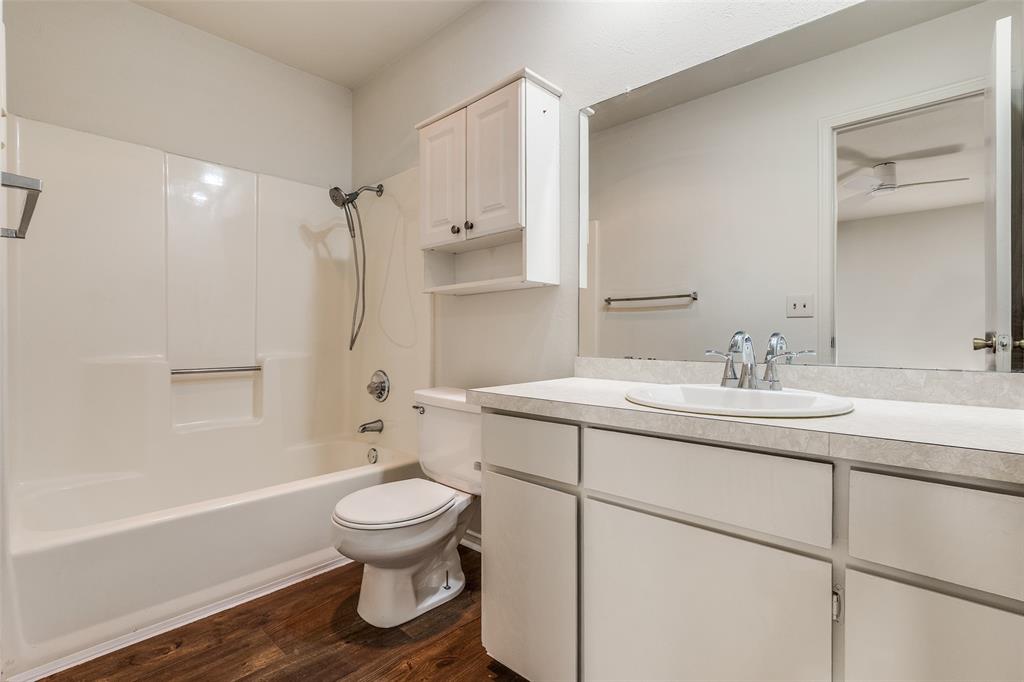 4728 Meadow Ridge Drive Dallas, TX 75236 - Photo 16 of 25 a bathroom with a sink toilet tub and vanity