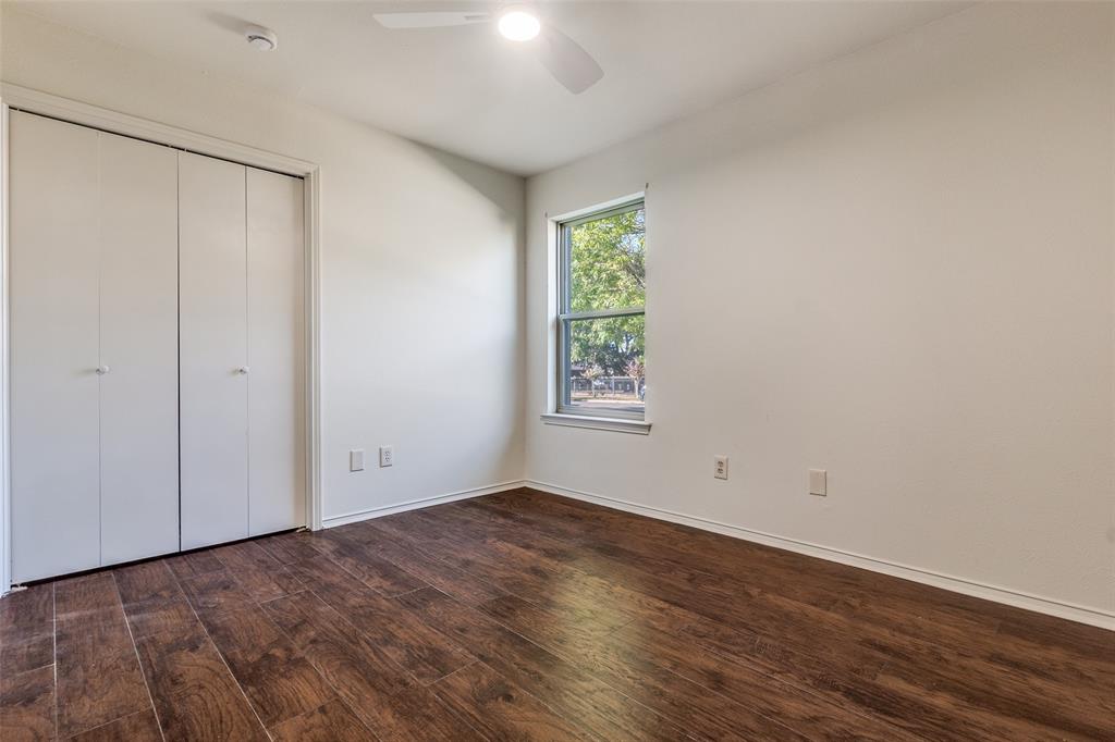 4728 Meadow Ridge Drive Dallas, TX 75236 - Photo 17 of 25 wooden floor in an empty room with a window