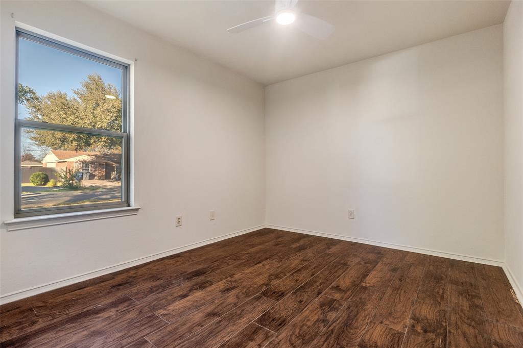 4728 Meadow Ridge Drive Dallas, TX 75236 - Photo 18 of 25 a view of empty room with wooden floor and fan