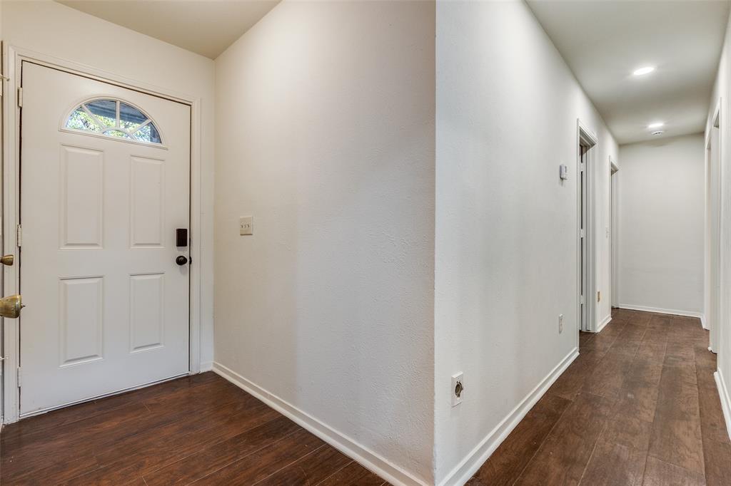 4728 Meadow Ridge Drive Dallas, TX 75236 - Photo 4 of 25 a view of hallway with wooden floor