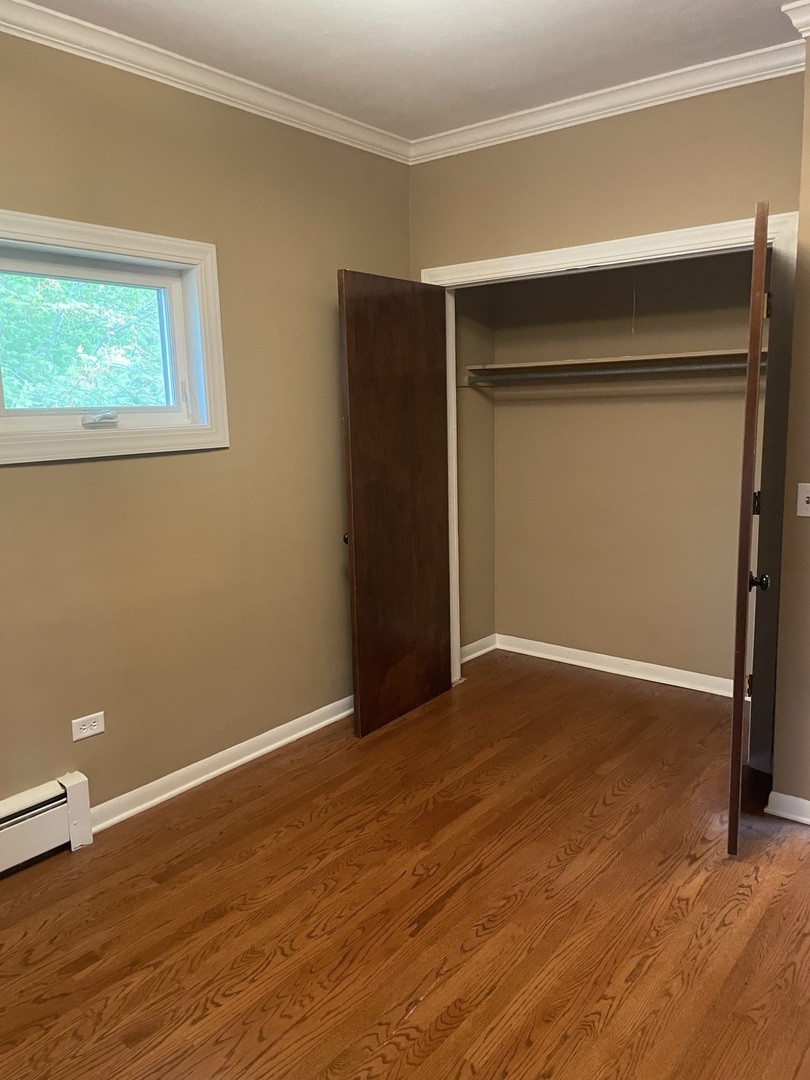 632 North Center Street, Unit 2W Naperville, IL 60563 - Photo 6 of 14 a view of an empty room with closet and a window