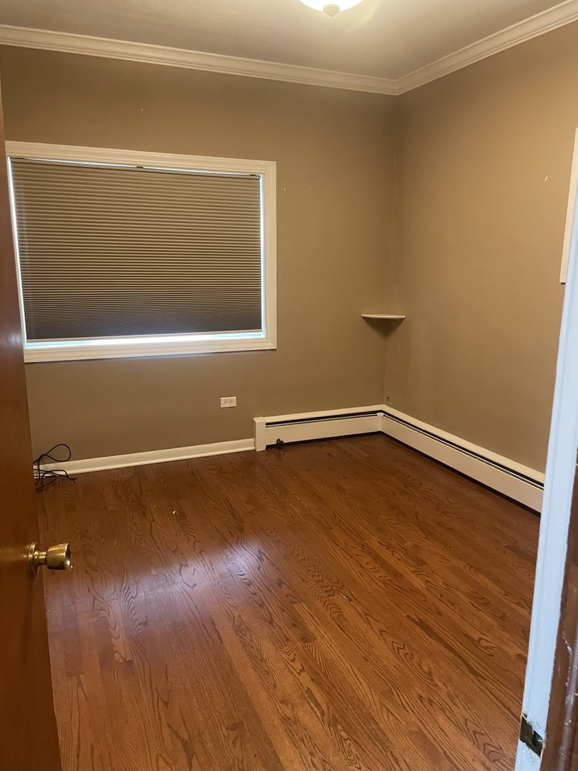 632 North Center Street, Unit 2W Naperville, IL 60563 - Photo 7 of 14 a view of a room with wooden floor