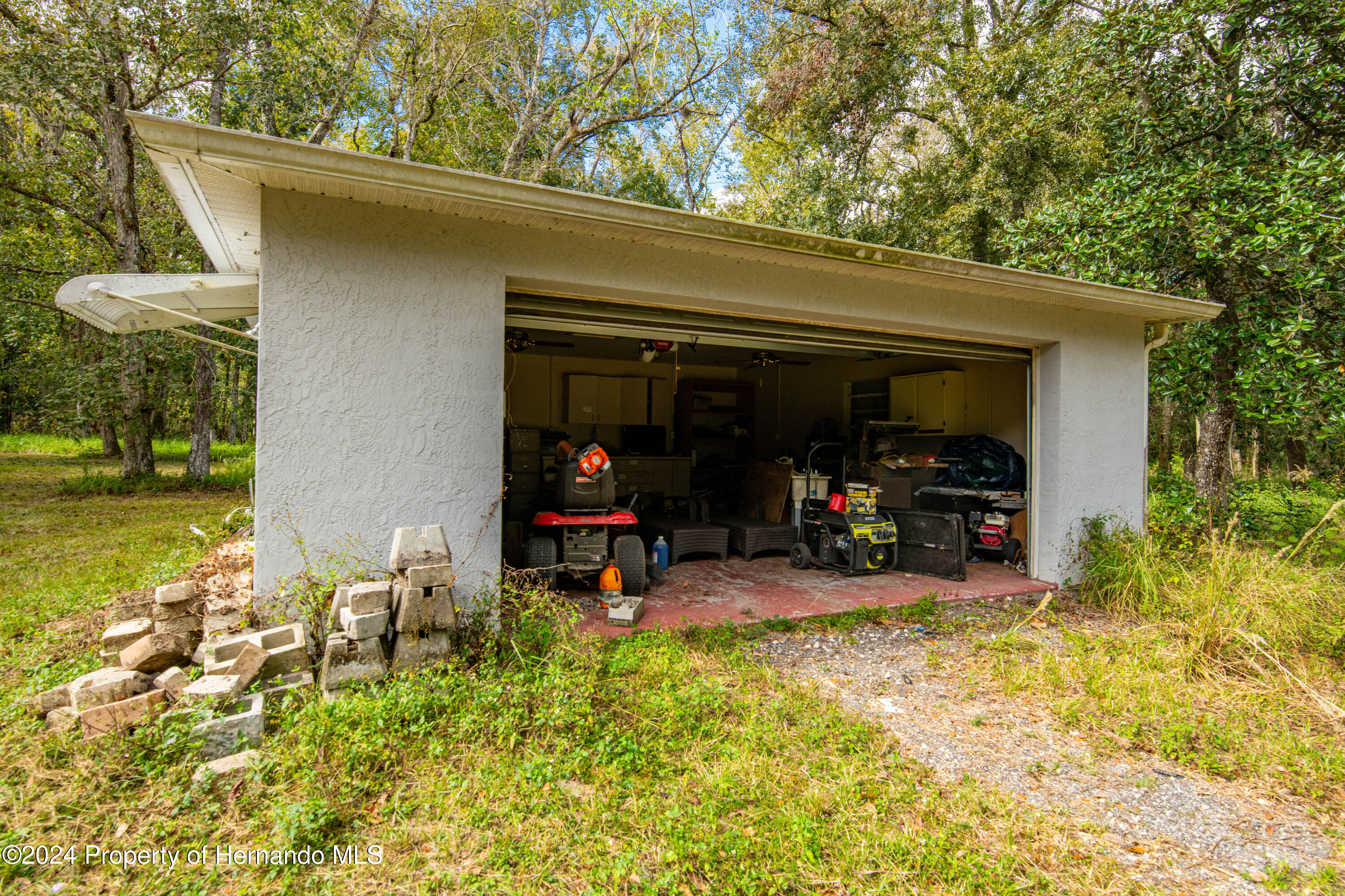 16109 Buczak Road Brooksville, FL 34614 - Photo 16 of 16 a view of a garage