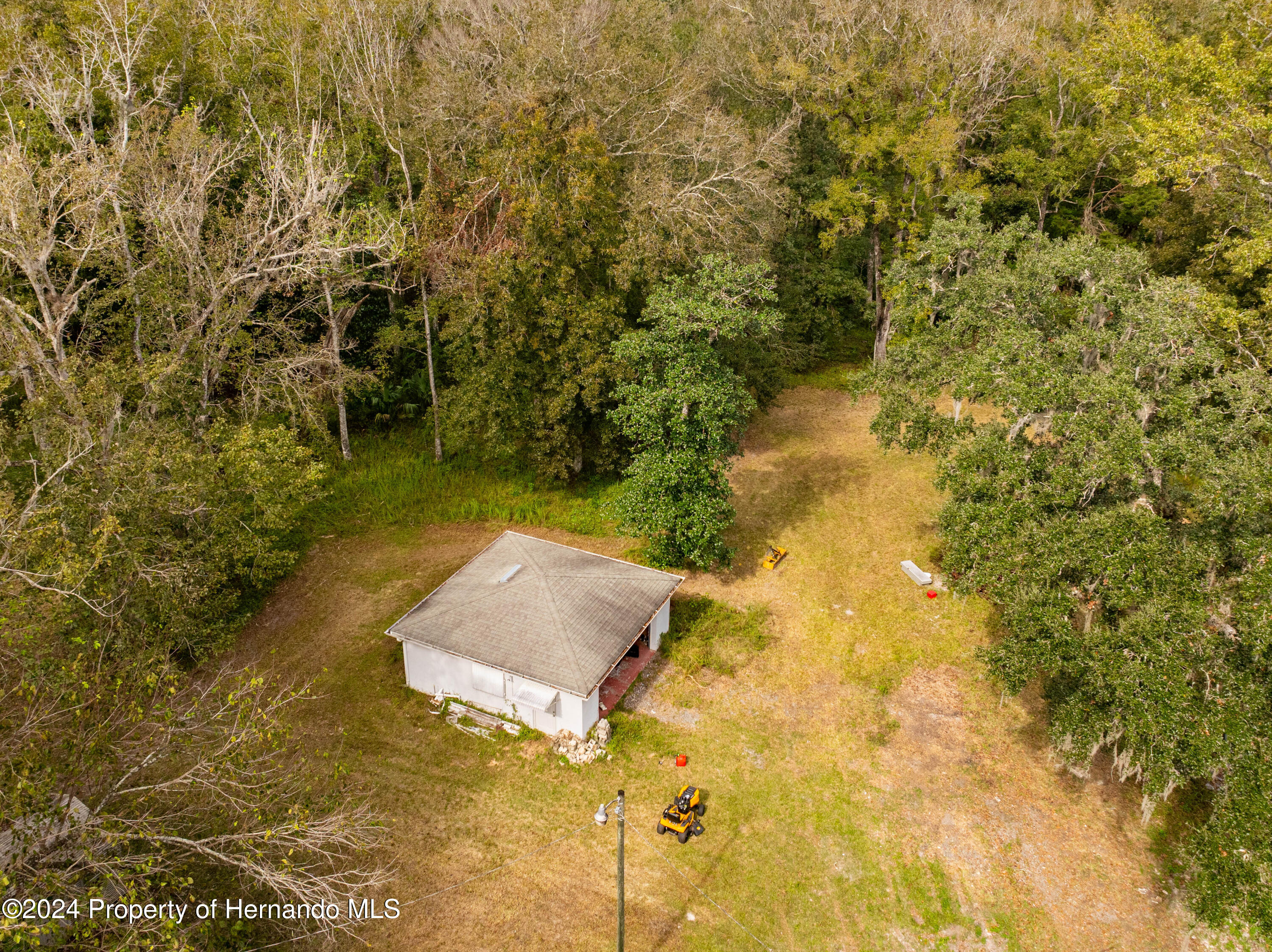 16109 Buczak Road Brooksville, FL 34614 - Photo 4 of 16 a view of a lake with a yard