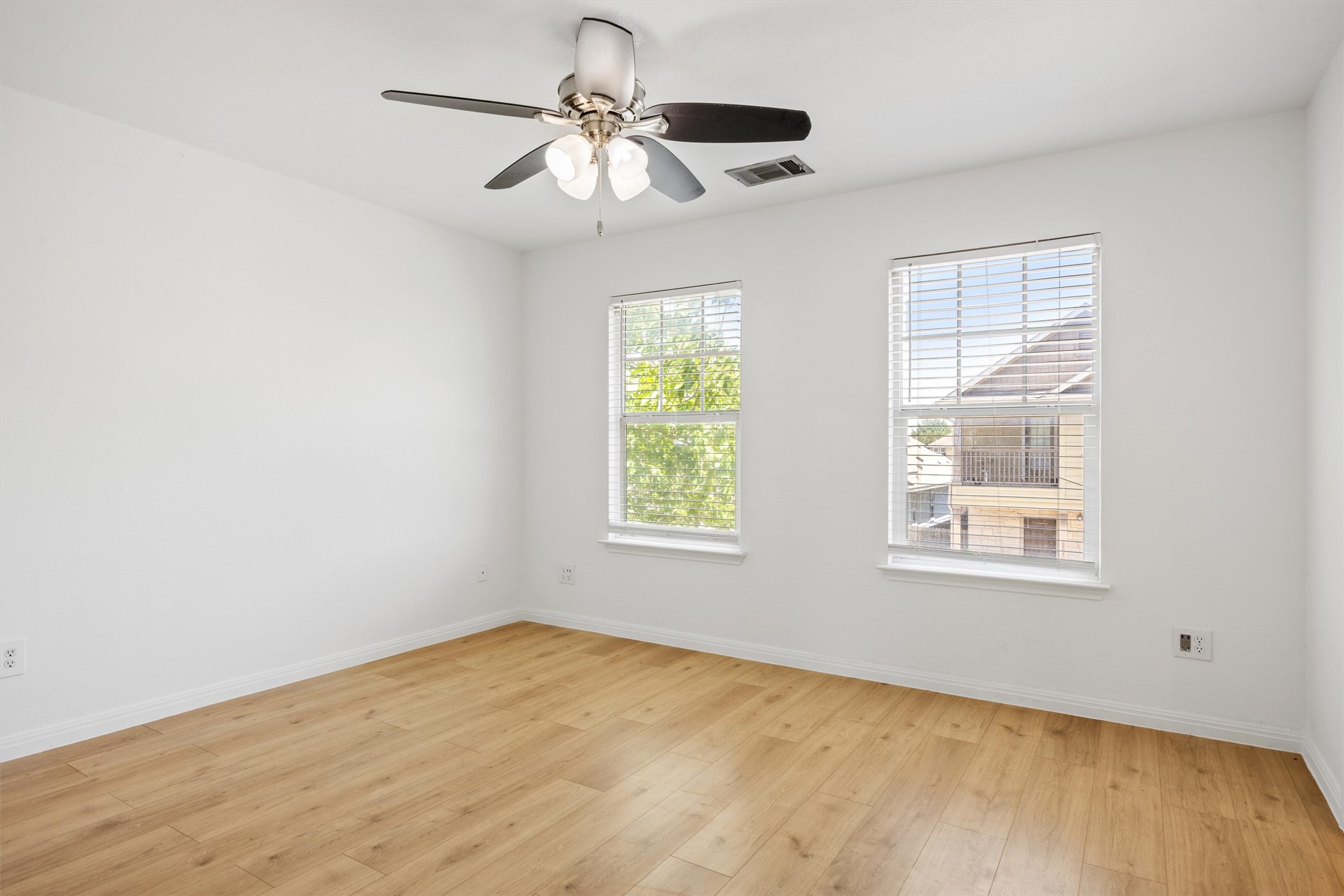 4516 Kind Way, Unit 253 Austin, TX 78725 - Photo 18 of 31 a view of an empty room with a window
