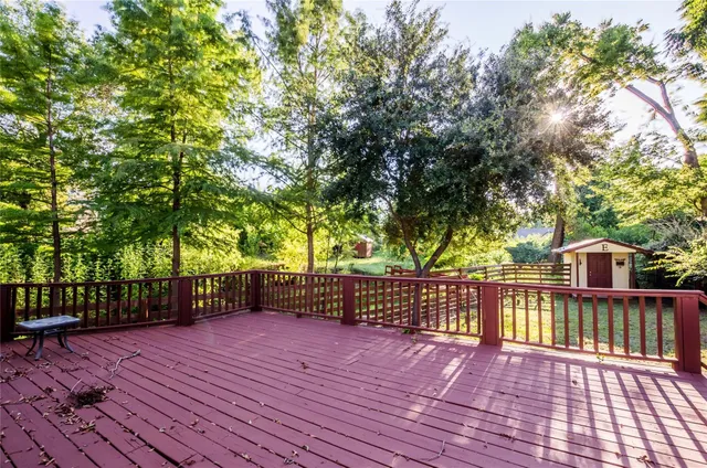 a view of a deck with a yard