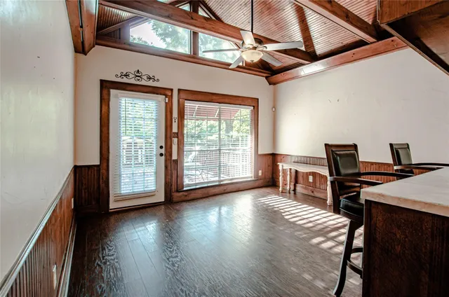a view of a livingroom with hardwood floor and a window
