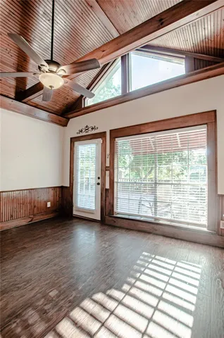 a view of a room with wooden floor and balcony