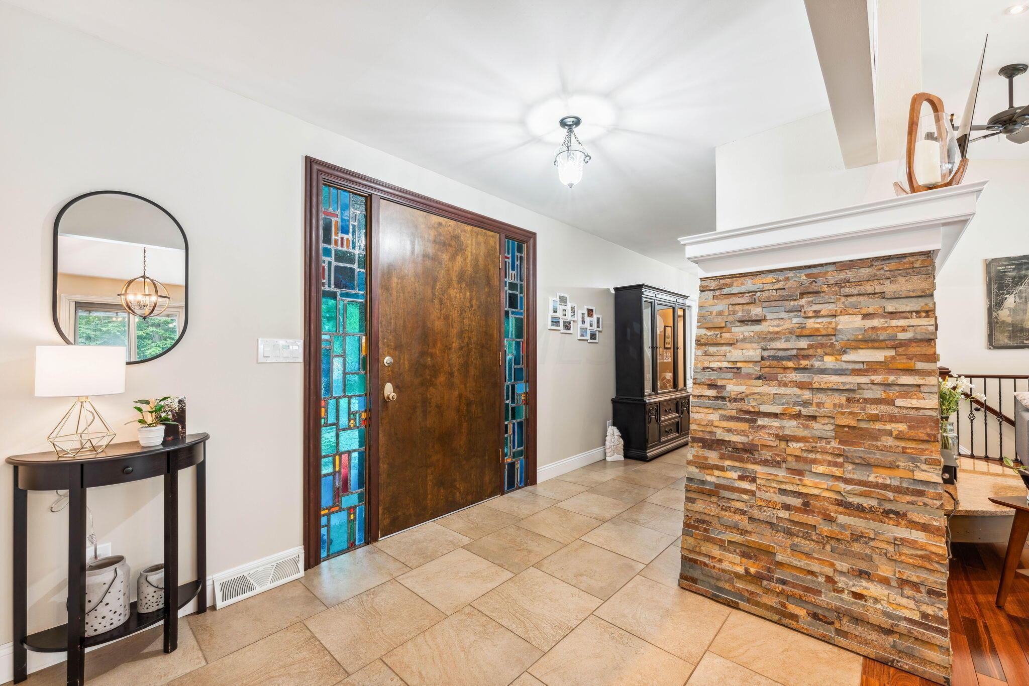 2423 Carriage Road Powell, OH 43065 - Photo 9 of 100 Stunning stained glass sidelights surround the front door!