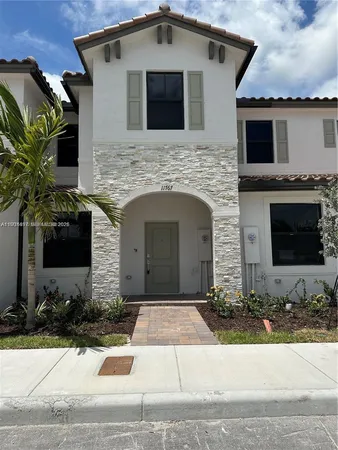 a front view of a house with yard