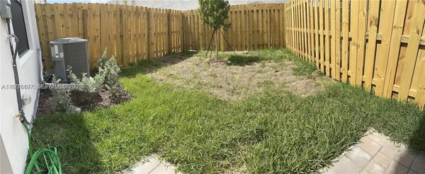 a view of a pathway of a park with plants