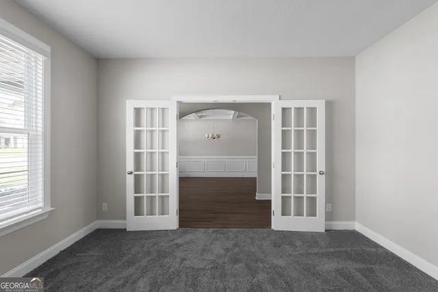 an empty room with windows