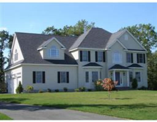 95 Mohawk Path, Unit LOT 109B Holliston, MA 01746 - Photo 1 of 1 a front view of a house with a garden