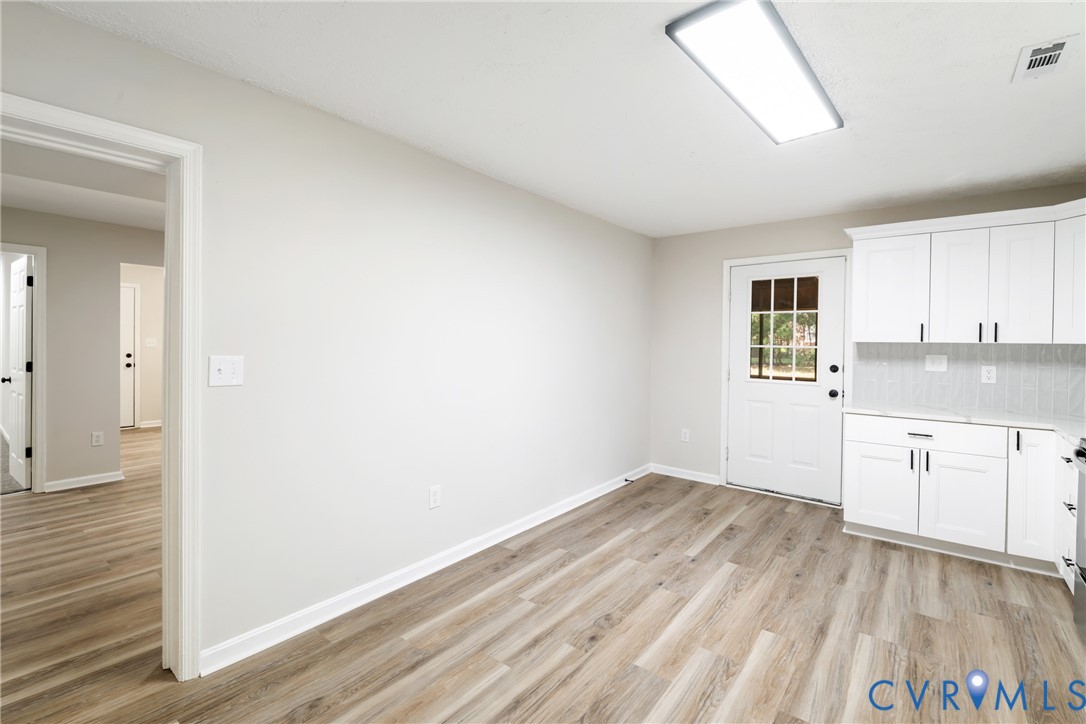 1531 Pughs Store Road Afton, VA 22920 - Photo 13 of 40 a kitchen with granite countertop white cabinets and white appliances