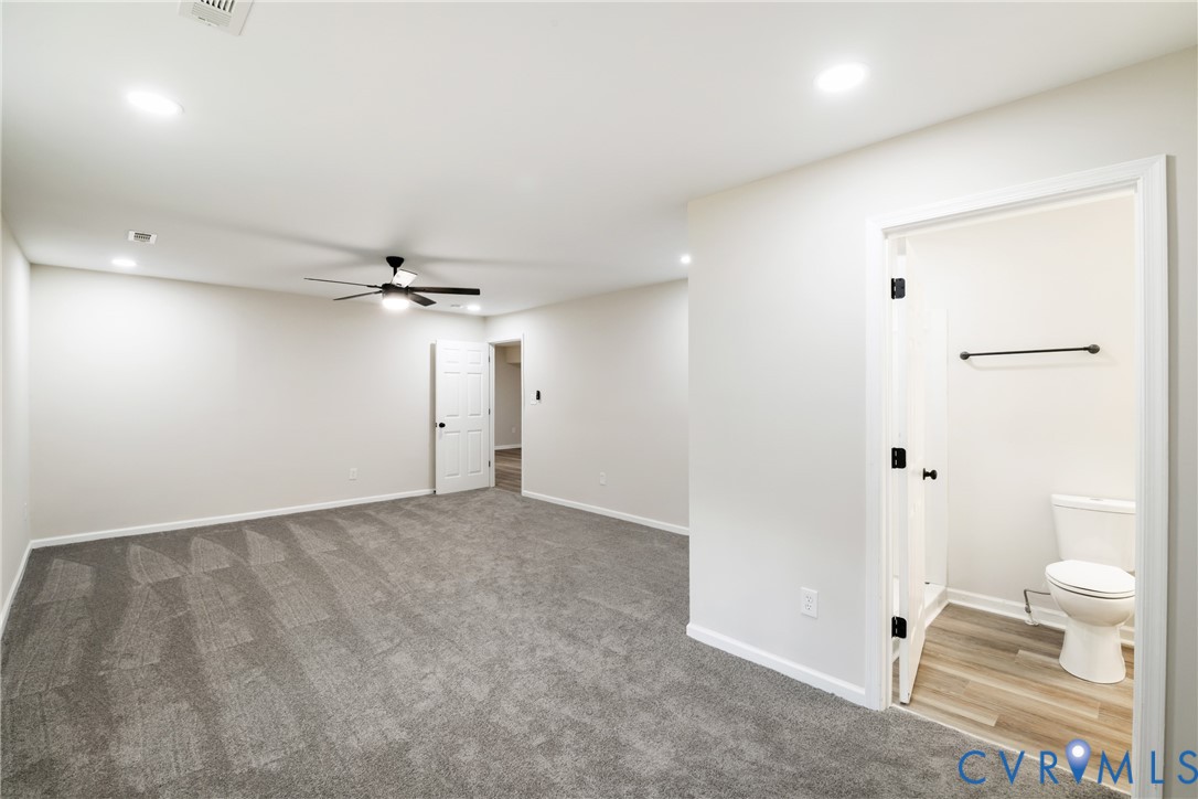 1531 Pughs Store Road Afton, VA 22920 - Photo 15 of 40 an empty room with an entryway and a chandelier fan