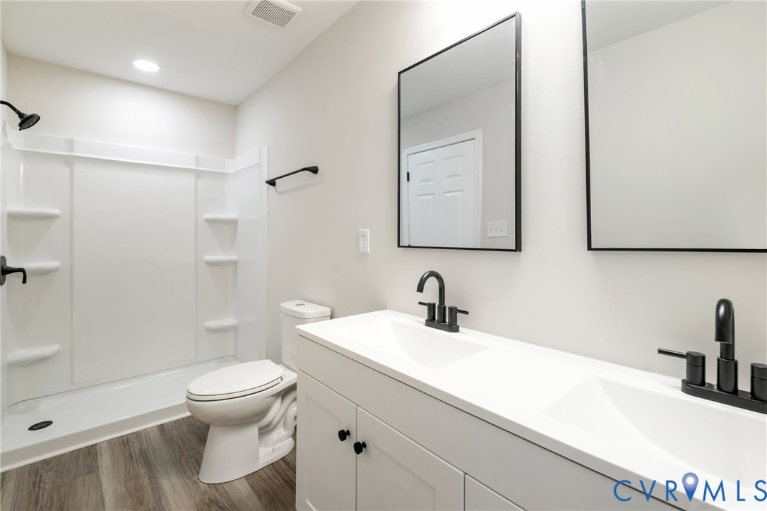 1531 Pughs Store Road Afton, VA 22920 - Photo 18 of 40 a bathroom with a sink a toilet and shower