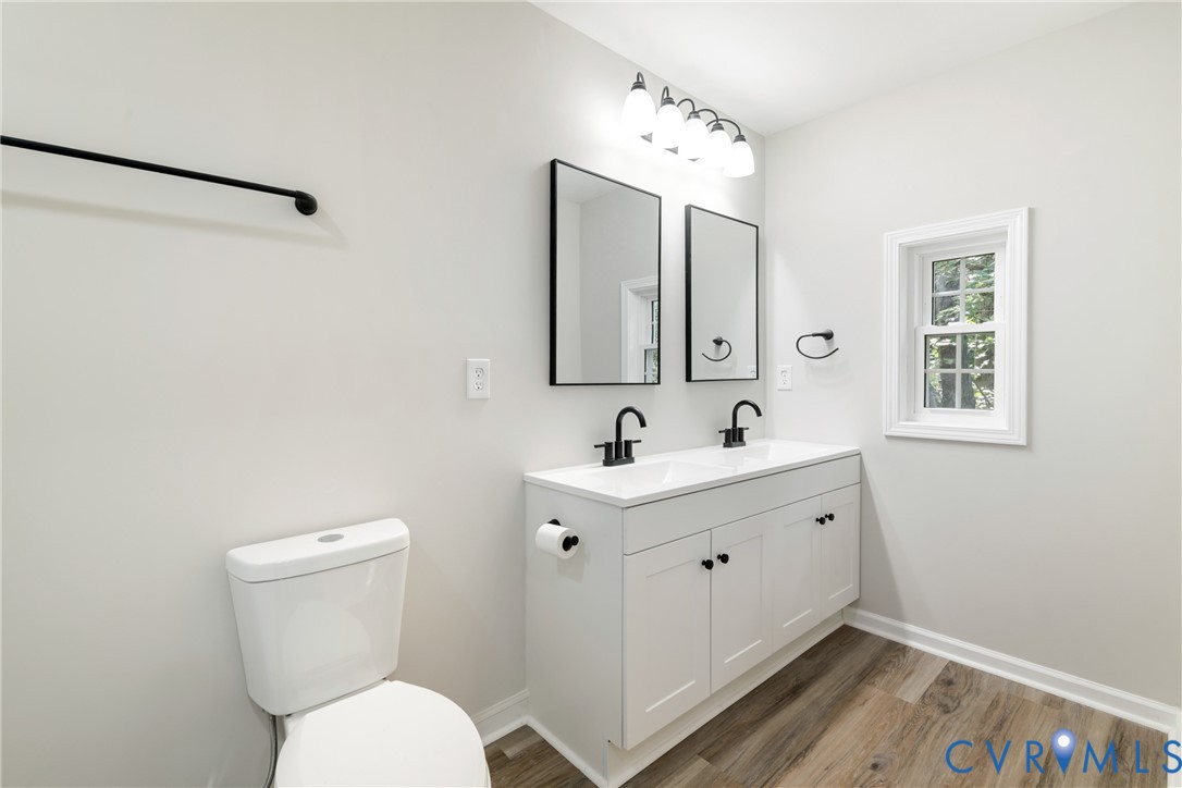 1531 Pughs Store Road Afton, VA 22920 - Photo 19 of 40 a bathroom with a toilet sink and mirror