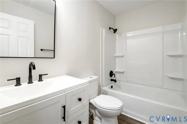 a bathroom with a sink a toilet and a bathtub