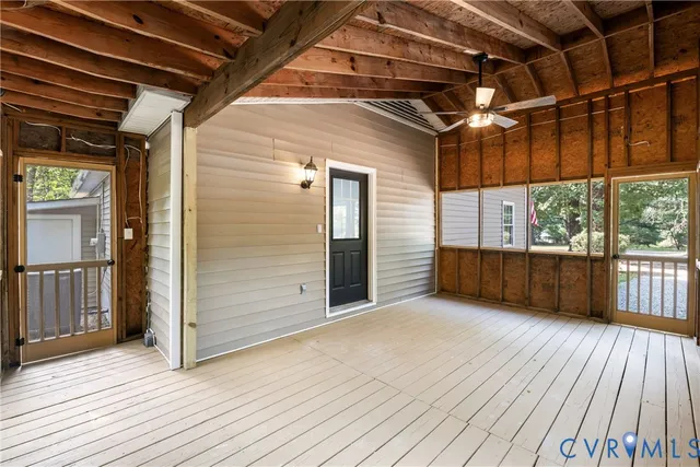 a view of porch with wooden floor