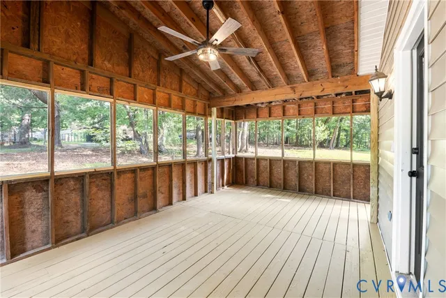 a view of a balcony with wooden floor