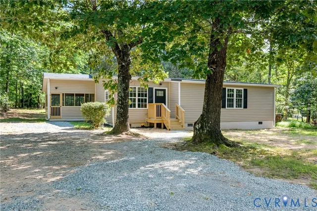 a view of a backyard with a large tree