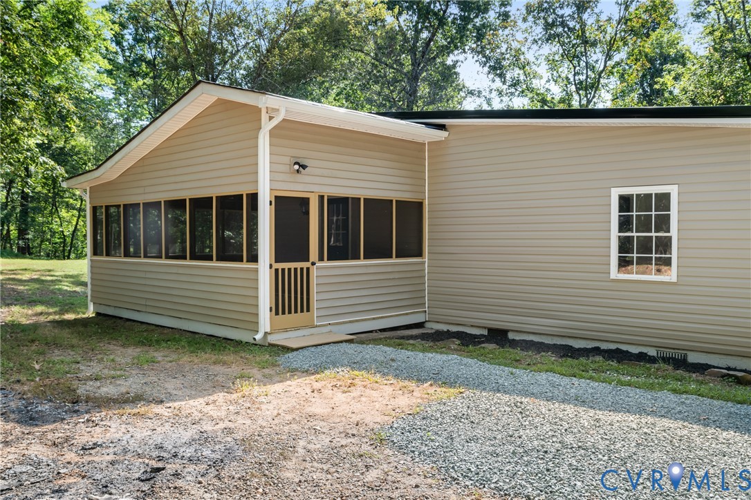 1531 Pughs Store Road Afton, VA 22920 - Photo 40 of 40 a view of a small white house with a small yard and large trees