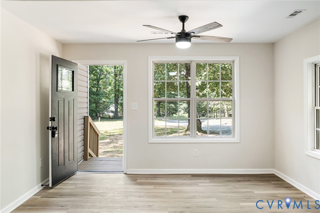 1531 Pughs Store Road Afton, VA 22920 - Photo 4 of 40 a view of an empty room with wooden floor and a window