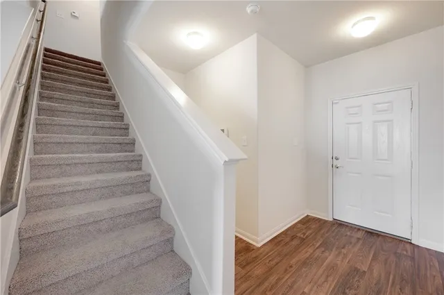 a view of entryway with wooden floor