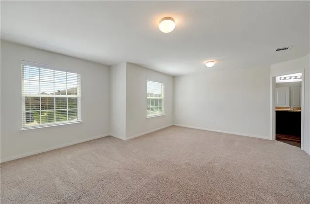 an empty room with windows