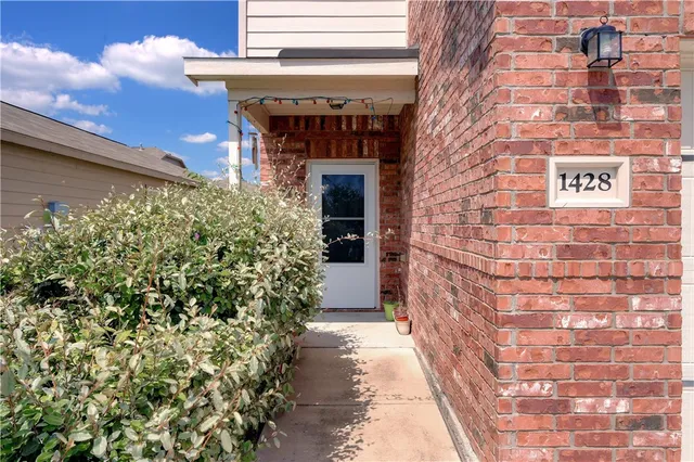 a view of a pathway door of the building