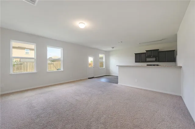 a view of a kitchen with a sink cabinets and a window