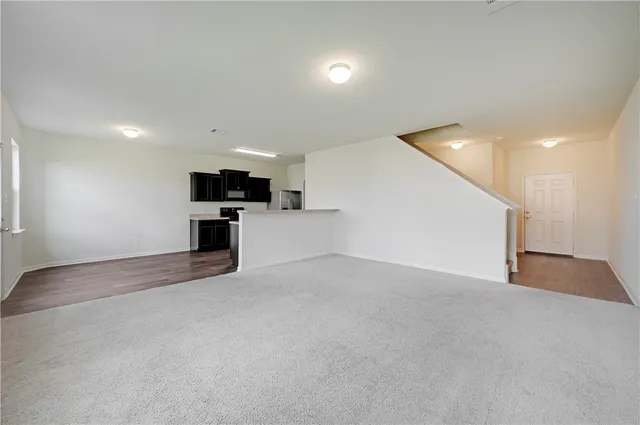 a view of a kitchen with a sink and a stove top oven