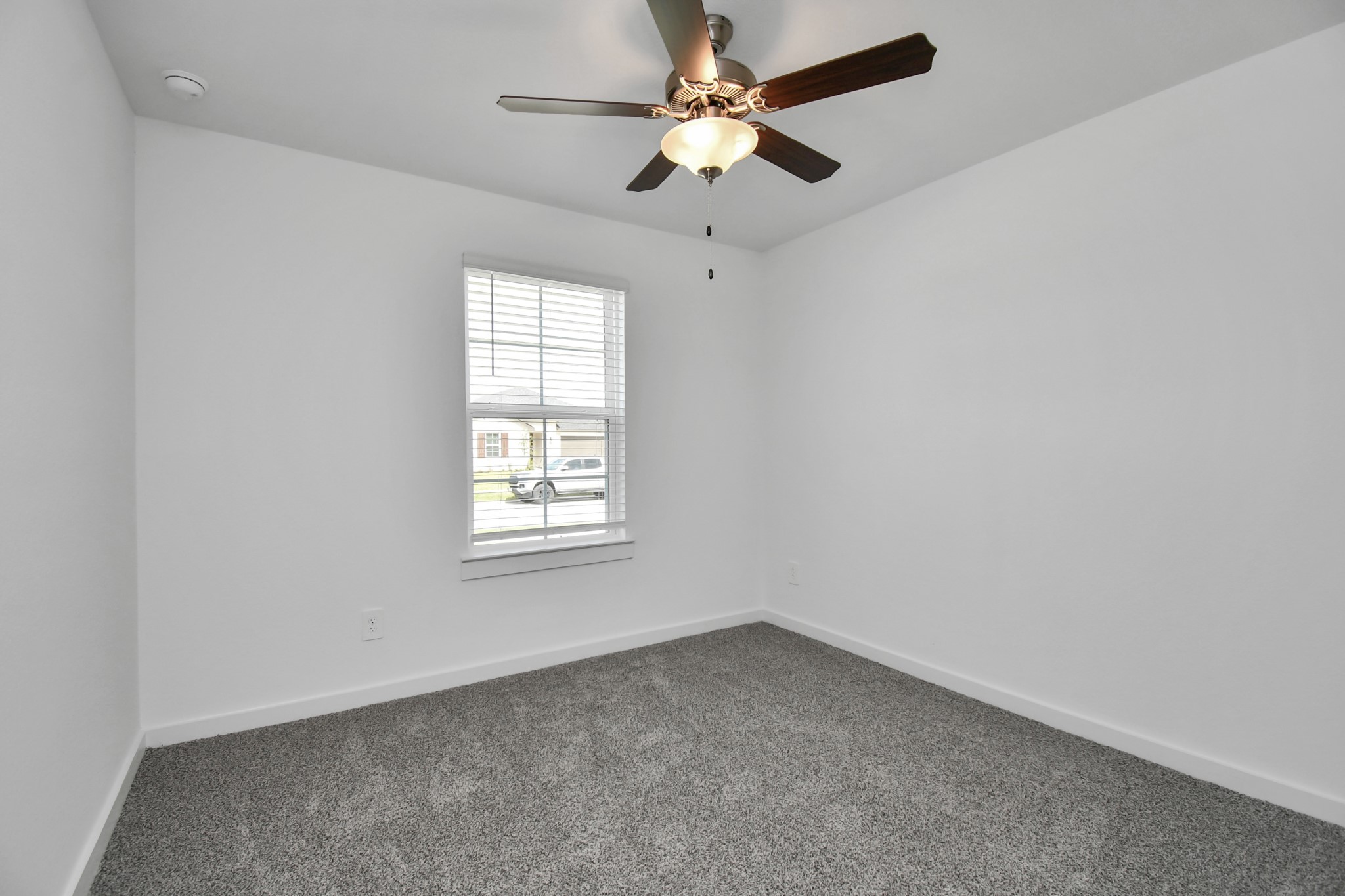 1110 Fringed Bluestar Drive Rosharon, TX 77583 - Photo 12 of 41 an empty room with a window and a fan