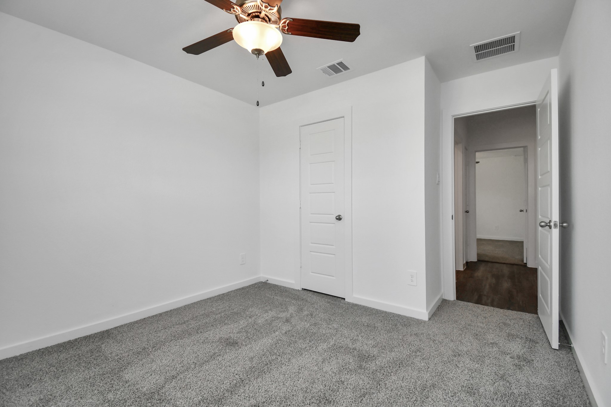 1110 Fringed Bluestar Drive Rosharon, TX 77583 - Photo 13 of 41 an empty room with closet and a chandelier fan