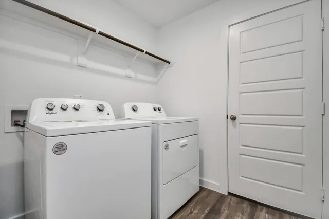 an empty room with a chandelier fan