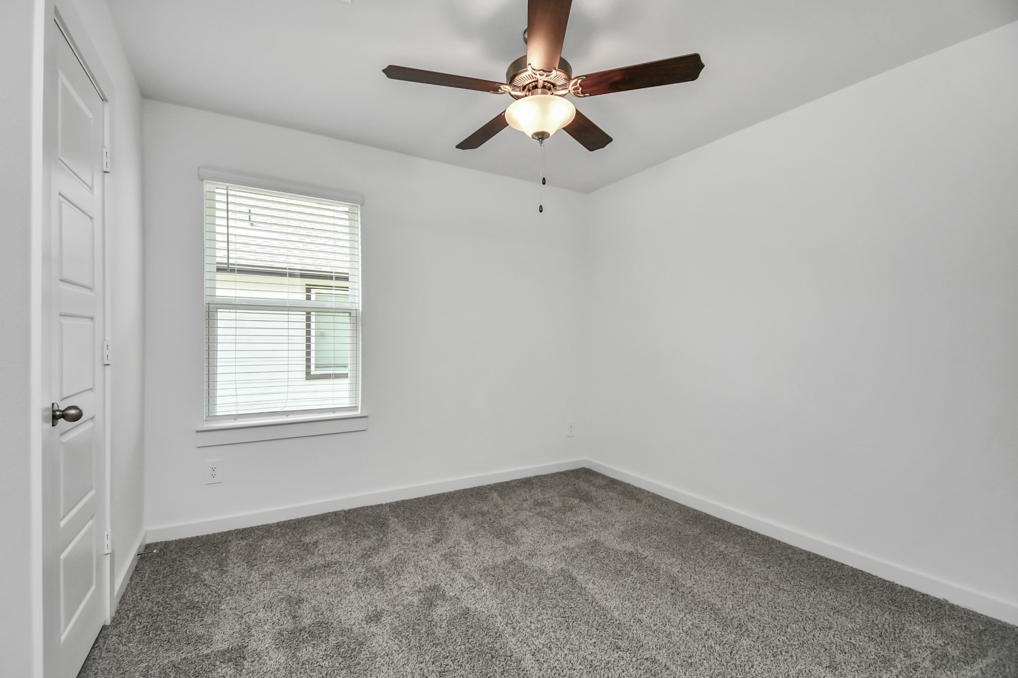 1110 Fringed Bluestar Drive Rosharon, TX 77583 - Photo 18 of 41 an empty room with a window and a fan