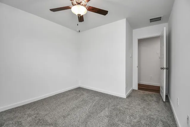 a kitchen with appliances a sink and cabinets