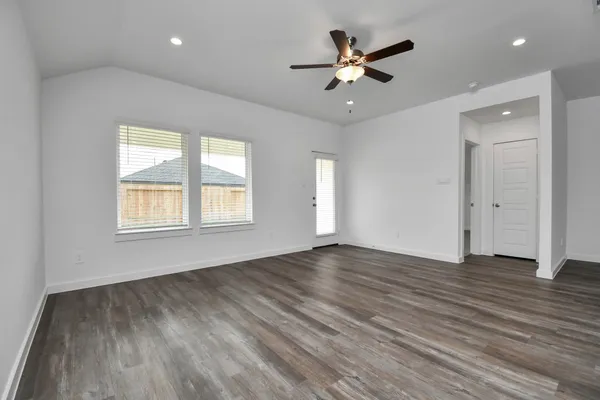 a view of kitchen with cabinets appliances and wooden floor
