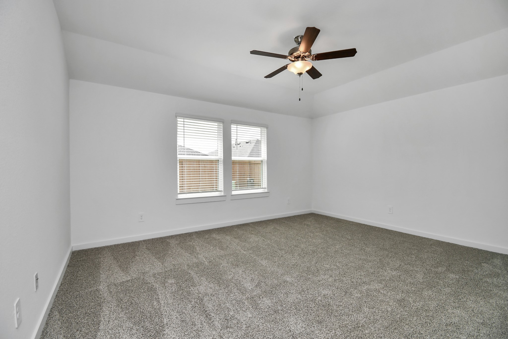 1110 Fringed Bluestar Drive Rosharon, TX 77583 - Photo 35 of 41 an empty room with ceiling fan and windows
