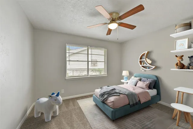 a bedroom with a bed and window