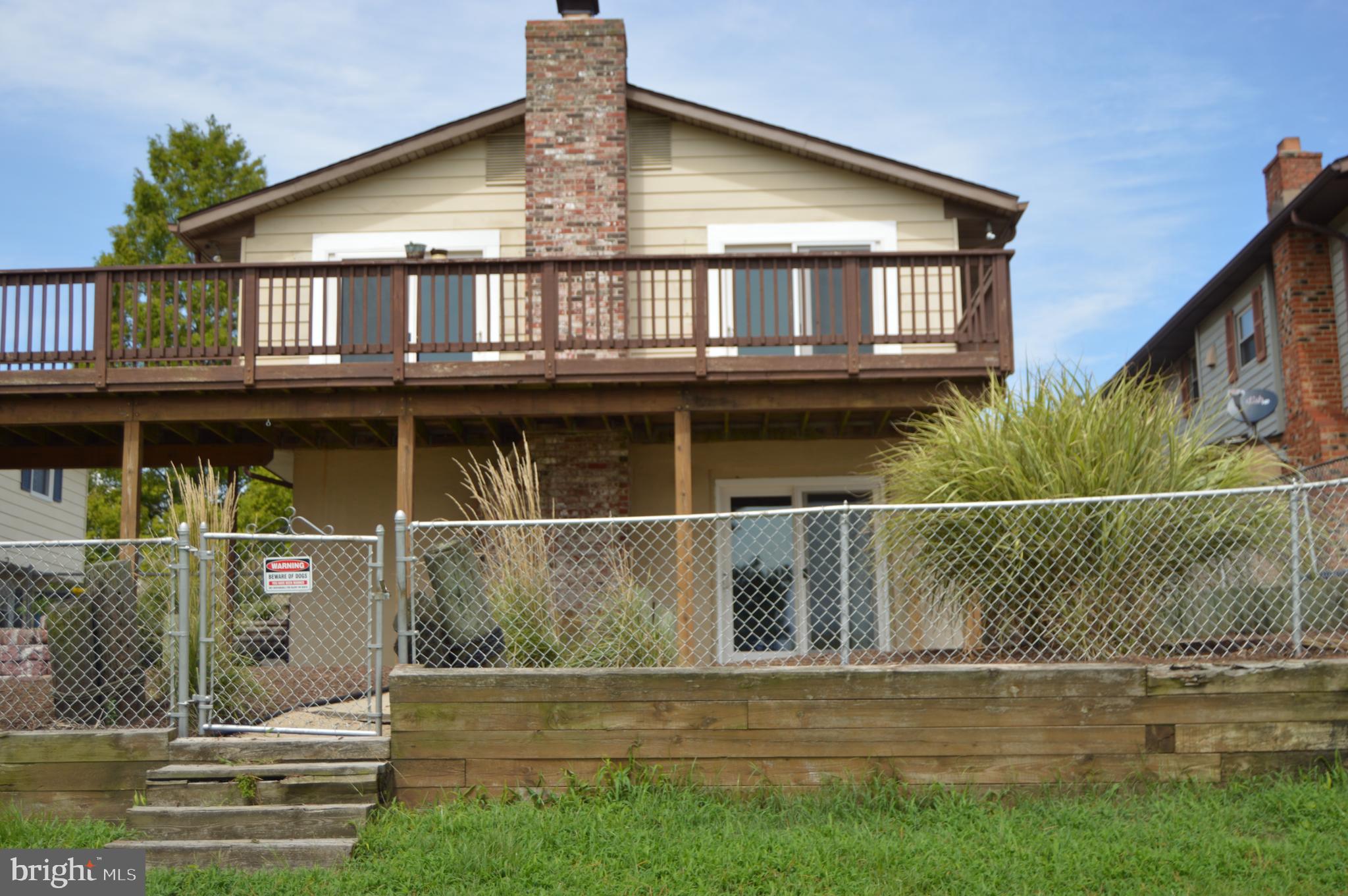Fenced yard looking over the water