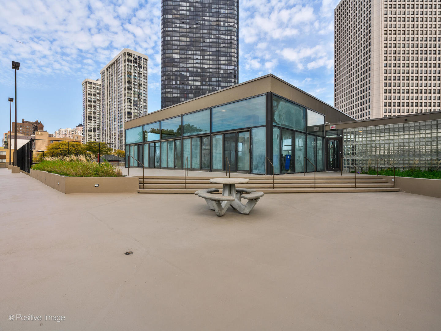 5320 North Sheridan Road, Unit 2206 Chicago, IL 60640 - Photo 18 of 20 a view of a house with barbeque in front of it