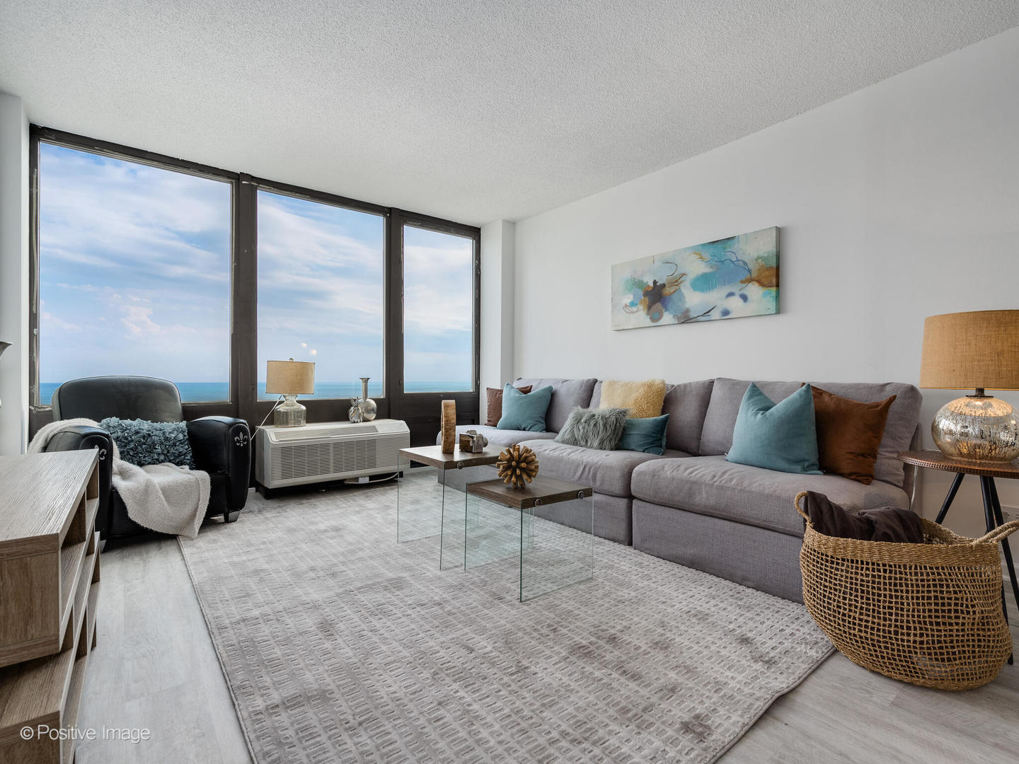 5320 North Sheridan Road, Unit 2206 Chicago, IL 60640 - Photo 3 of 20 a living room with furniture and a large window