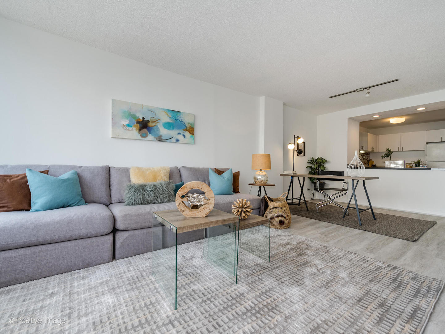 5320 North Sheridan Road, Unit 2206 Chicago, IL 60640 - Photo 5 of 20 a living room with furniture and a dining table with kitchen view