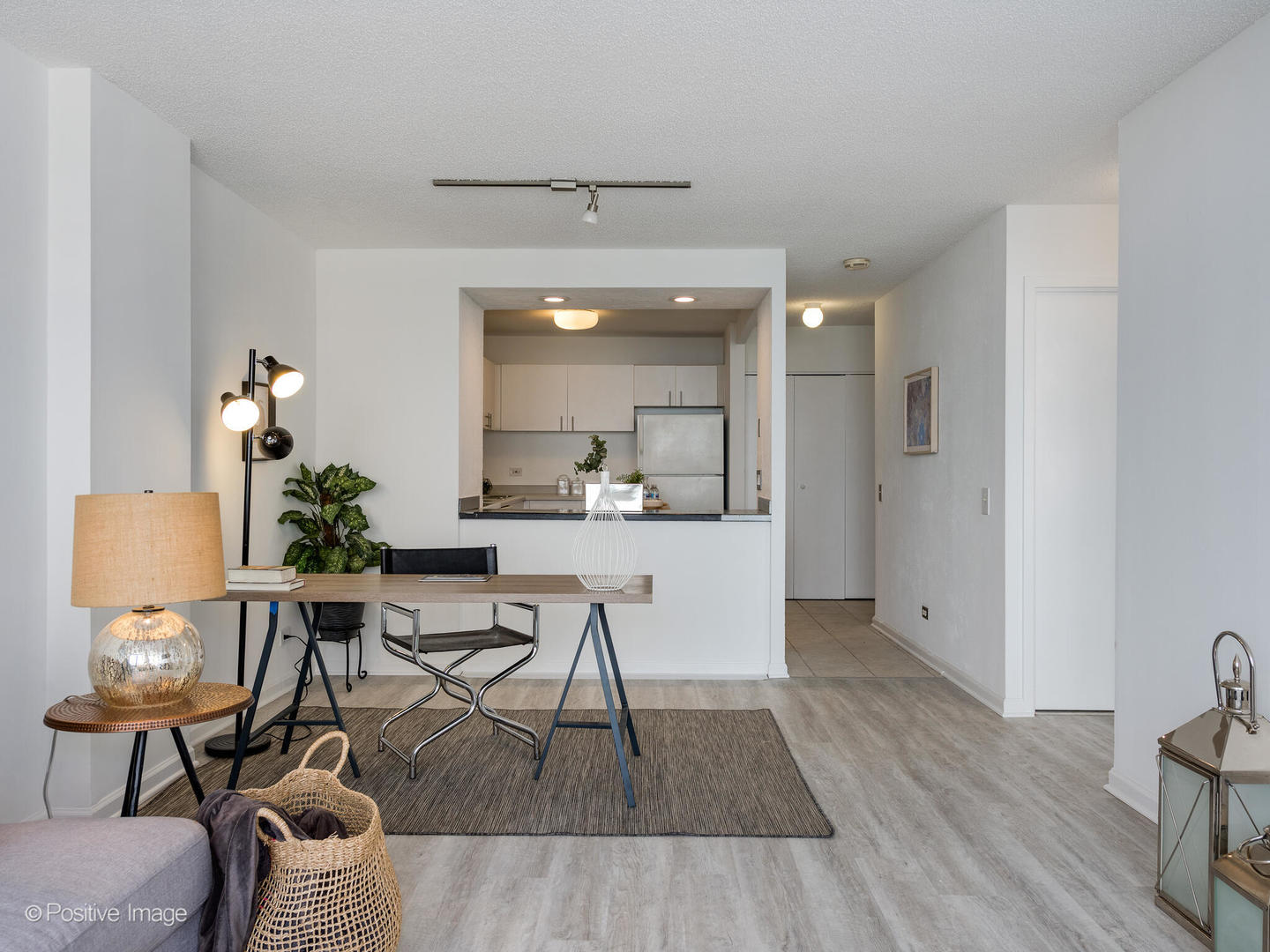 5320 North Sheridan Road, Unit 2206 Chicago, IL 60640 - Photo 6 of 20 a view of a dining room with furniture and wooden floor