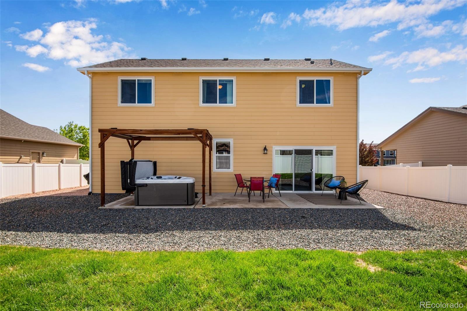 7035 McClellan Road Wellington, CO 80549 - Photo 25 of 43 a front view of a house with a yard