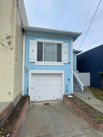 a front view of a house with a garage